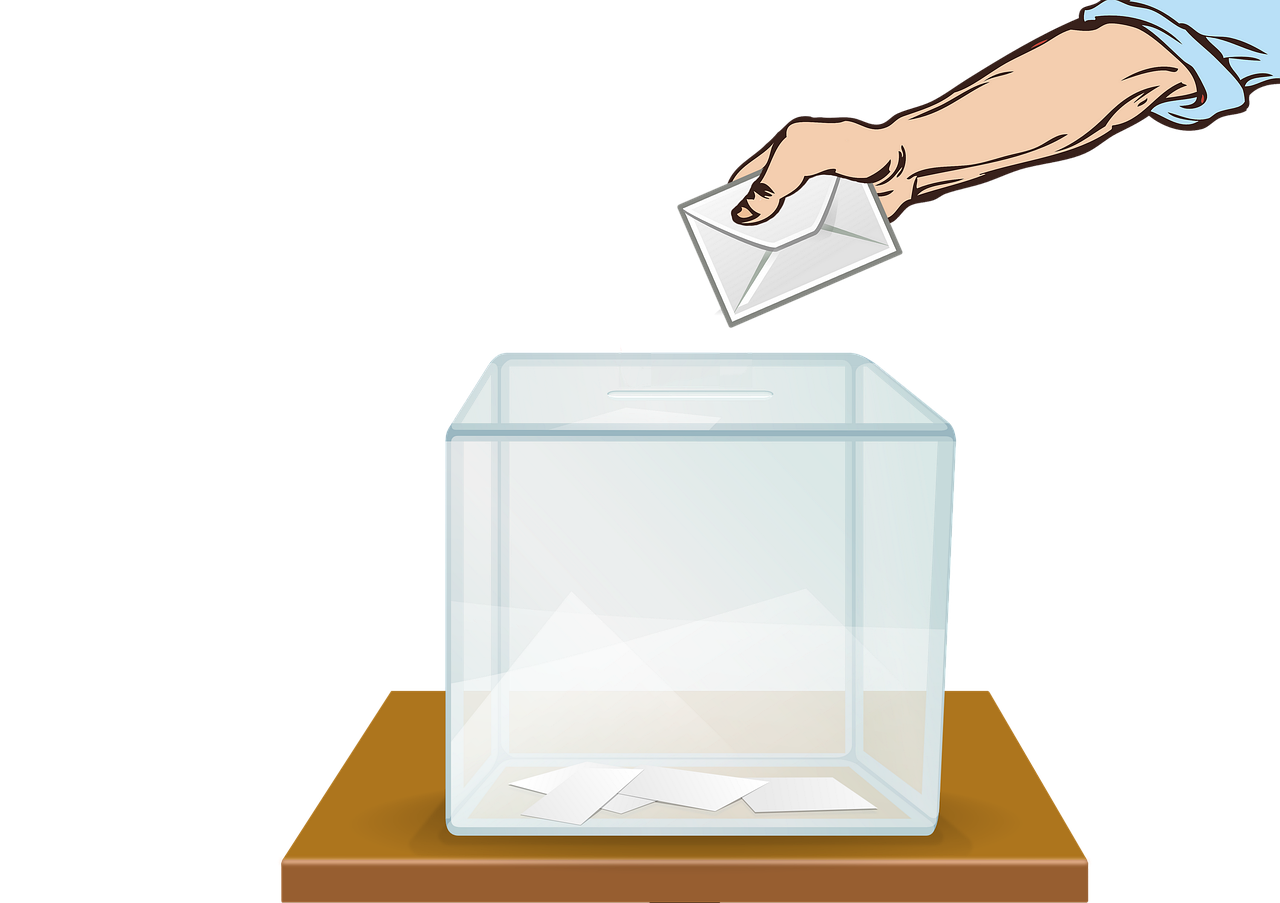 Grafik Hand die einen Brief in eine Wahlurne steckt